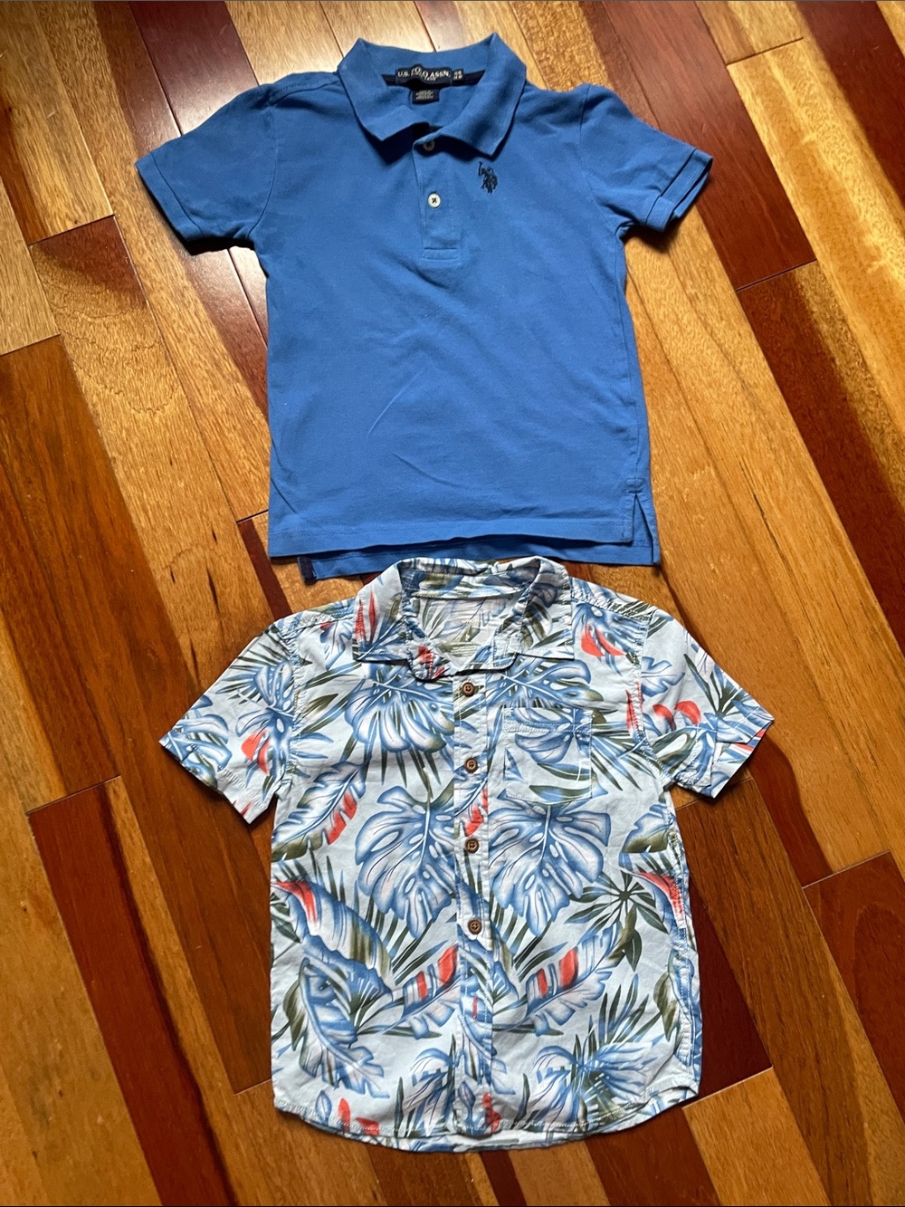 Two shirts for 5-year-old boys: one polo and one button-up dress shirt.